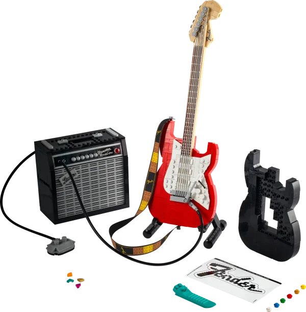 Create your own brick-built 1970s Fender® Stratocaster™ guitar and 65 Princeton® Reverb amplifier with this LEGO® Ideas set (21329). Recall the legendary musicians who have played a Stratocaster® as you recreate its iconic curves and add authentic details such as the posable whammy bar, pickup switch and tuning pegs. The buildable amp has removable panels for easy viewing of the motherboard, reverb tank, speaker and other interior details, plus rubber cables to connect it to the guitar and footswitch. Striking centerpiece This set includes bricks to build the guitar in either red or black, guitar picks in 4 colors and an elegant, foldable stand for the guitar model to complete a delightful display piece. There is also a sticker with the Fender logo made from LEGO bricks for you to attach to your real guitar or amp. Cool collectible This building kit is part of a collection of LEGO sets for adults. It’s a top gift idea for guitar players, Fender fans, music lovers and keen LEGO builders. Recreate a legendary guitar with this wonderfully detailed LEGO® Ideas build-and-display model (21329) of a 1970s Fender® Stratocaster® guitar and a buildable Fender 65 Princeton® Reverb amplifier. The guitar features a posable whammy bar, pickup switch and tuning pegs, six strings, Fender® logo stickers, and a textile strap. The bricks included let you build the guitar in red or black. The amplifier has removable panels for easy viewing of the motherboard, reverb tank, speaker and other interior details, logo stickers, plus connecting rubber cables for the guitar and footswitch. Includes a foldable display stand for the guitar, model-scale guitar picks in 4 colors, plus a sticker of the Fender® logo built from LEGO® bricks to put on your real guitar, amp or wherever you want. Guitar measures over 14 in. (36 cm) long, 4 in. (11 cm) wide and 1 in. (3 cm) deep. This LEGO® display model makes a cool gift for guitar players, music lovers and Fender® Stratocaster® guitar fans. Fun to build solo or with friends and family to share your love of this iconic guitar, music and/or building with LEGO® bricks. This 1,079-piece set comes with a booklet about the history of the Fender® Stratocaster® guitar, the set’s fan designer and LEGO® designers, plus step-by-step instructions for a joyful build. This cool building set was entered in the LEGO® Ideas ‘Music to our Ears’ contest by a fan designer and chosen from the top 9 entries to become the next LEGO Ideas set by the LEGO Ideas review board. LEGO® components meet stringent industry standards to ensure simple, secure connections and robust builds. It’s been that way since 1958. LEGO® building bricks and pieces are tested in almost every way imaginable to ensure that every LEGO set satisfies rigorous global safety standards.