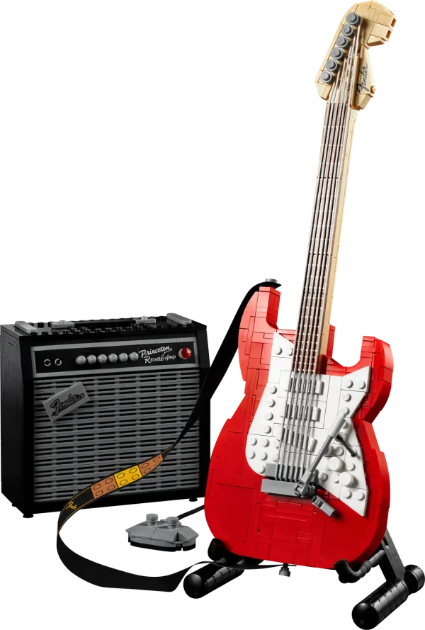 Create your own brick-built 1970s Fender® Stratocaster™ guitar and 65 Princeton® Reverb amplifier with this LEGO® Ideas set (21329). Recall the legendary musicians who have played a Stratocaster® as you recreate its iconic curves and add authentic details such as the posable whammy bar, pickup switch and tuning pegs. The buildable amp has removable panels for easy viewing of the motherboard, reverb tank, speaker and other interior details, plus rubber cables to connect it to the guitar and footswitch. Striking centerpiece This set includes bricks to build the guitar in either red or black, guitar picks in 4 colors and an elegant, foldable stand for the guitar model to complete a delightful display piece. There is also a sticker with the Fender logo made from LEGO bricks for you to attach to your real guitar or amp. Cool collectible This building kit is part of a collection of LEGO sets for adults. It’s a top gift idea for guitar players, Fender fans, music lovers and keen LEGO builders. Recreate a legendary guitar with this wonderfully detailed LEGO® Ideas build-and-display model (21329) of a 1970s Fender® Stratocaster® guitar and a buildable Fender 65 Princeton® Reverb amplifier. The guitar features a posable whammy bar, pickup switch and tuning pegs, six strings, Fender® logo stickers, and a textile strap. The bricks included let you build the guitar in red or black. The amplifier has removable panels for easy viewing of the motherboard, reverb tank, speaker and other interior details, logo stickers, plus connecting rubber cables for the guitar and footswitch. Includes a foldable display stand for the guitar, model-scale guitar picks in 4 colors, plus a sticker of the Fender® logo built from LEGO® bricks to put on your real guitar, amp or wherever you want. Guitar measures over 14 in. (36 cm) long, 4 in. (11 cm) wide and 1 in. (3 cm) deep. This LEGO® display model makes a cool gift for guitar players, music lovers and Fender® Stratocaster® guitar fans. Fun to build solo or with friends and family to share your love of this iconic guitar, music and/or building with LEGO® bricks. This 1,079-piece set comes with a booklet about the history of the Fender® Stratocaster® guitar, the set’s fan designer and LEGO® designers, plus step-by-step instructions for a joyful build. This cool building set was entered in the LEGO® Ideas ‘Music to our Ears’ contest by a fan designer and chosen from the top 9 entries to become the next LEGO Ideas set by the LEGO Ideas review board. LEGO® components meet stringent industry standards to ensure simple, secure connections and robust builds. It’s been that way since 1958. LEGO® building bricks and pieces are tested in almost every way imaginable to ensure that every LEGO set satisfies rigorous global safety standards.