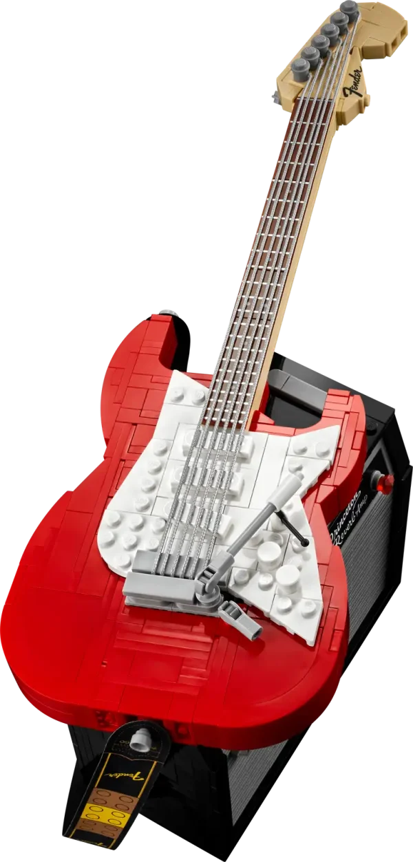 Create your own brick-built 1970s Fender® Stratocaster™ guitar and 65 Princeton® Reverb amplifier with this LEGO® Ideas set (21329). Recall the legendary musicians who have played a Stratocaster® as you recreate its iconic curves and add authentic details such as the posable whammy bar, pickup switch and tuning pegs. The buildable amp has removable panels for easy viewing of the motherboard, reverb tank, speaker and other interior details, plus rubber cables to connect it to the guitar and footswitch. Striking centerpiece This set includes bricks to build the guitar in either red or black, guitar picks in 4 colors and an elegant, foldable stand for the guitar model to complete a delightful display piece. There is also a sticker with the Fender logo made from LEGO bricks for you to attach to your real guitar or amp. Cool collectible This building kit is part of a collection of LEGO sets for adults. It’s a top gift idea for guitar players, Fender fans, music lovers and keen LEGO builders. Recreate a legendary guitar with this wonderfully detailed LEGO® Ideas build-and-display model (21329) of a 1970s Fender® Stratocaster® guitar and a buildable Fender 65 Princeton® Reverb amplifier. The guitar features a posable whammy bar, pickup switch and tuning pegs, six strings, Fender® logo stickers, and a textile strap. The bricks included let you build the guitar in red or black. The amplifier has removable panels for easy viewing of the motherboard, reverb tank, speaker and other interior details, logo stickers, plus connecting rubber cables for the guitar and footswitch. Includes a foldable display stand for the guitar, model-scale guitar picks in 4 colors, plus a sticker of the Fender® logo built from LEGO® bricks to put on your real guitar, amp or wherever you want. Guitar measures over 14 in. (36 cm) long, 4 in. (11 cm) wide and 1 in. (3 cm) deep. This LEGO® display model makes a cool gift for guitar players, music lovers and Fender® Stratocaster® guitar fans. Fun to build solo or with friends and family to share your love of this iconic guitar, music and/or building with LEGO® bricks. This 1,079-piece set comes with a booklet about the history of the Fender® Stratocaster® guitar, the set’s fan designer and LEGO® designers, plus step-by-step instructions for a joyful build. This cool building set was entered in the LEGO® Ideas ‘Music to our Ears’ contest by a fan designer and chosen from the top 9 entries to become the next LEGO Ideas set by the LEGO Ideas review board. LEGO® components meet stringent industry standards to ensure simple, secure connections and robust builds. It’s been that way since 1958. LEGO® building bricks and pieces are tested in almost every way imaginable to ensure that every LEGO set satisfies rigorous global safety standards.