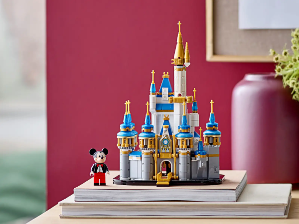 Celebrate the Walt Disney World® Resort’s 50th anniversary with this LEGO® ǀ Disney Mini Disney Castle (40478) set! Fans of Disney’s flagship Magic Kingdom® Park can recreate the iconic Walt Disney World® Resort Cinderella Castle, complete with pearlized golden tower tops, opalescent blue rooftop cones and a vintage-style Mickey Mouse minifigure. This unique display piece makes a perfect gift for birthdays, holidays or other celebrations. Disney fans of all ages will love this beautiful miniature of the flagship Walt Disney World® Resort Cinderella Castle attraction from Disney’s Magic Kingdom® Park in Florida, and a vintage-style Mickey Mouse minifigure. A great gift idea for ages 12 and up, this 567-piece building set makes a unique addition to any Disney collection. Measuring over 8 in. (21 cm) high, 5.5 in. (14 cm) wide and 5.5 in. (13 cm) deep, this LEGO® ǀ Disney Mini Disney Castle makes a striking display piece standing on a mantelpiece or shelf in your home or office.