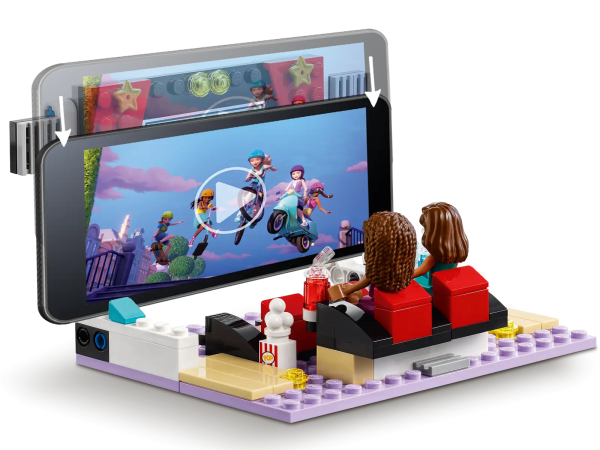 Treat kids to a red-carpet play experience as they imagine attending a movie premier at the LEGO® Friends Heartlake City Movie Theater (41448). This gift for kids features an art deco-style cinema packed with authentic details, such as a VIP area, popcorn kiosk and slushy cups. It comes complete with a starlet, ready to sign autographs for adoring fans. Everything in a toy a kid needs to transport them to a glamorous night at the movies. In the director's chair The model is hinged so kids can open it out to reveal a VIP screening room with exclusive seats for 5 of their most fabulous friends. The characters can ‘view’ the film on the screen, but this also flips to accommodate a cell phone, so kids can play director by showing their very own movies. Realistic role-play adventures LEGO Heartlake City birthday gifts for kids come packed with real-world details and relatable characters. They encourage kids to conjure up a creative world of role-play fun, alone or with their friends and family. Dazzle a movie-mad youngster with LEGO® Friends Heartlake City Movie Theater (41448). It’s premier night at this vintage-style cinema, with a red carpet and a glamorous LEGO Friends movie star! This hinged toy playset features a ticket desk and red-carpet area on one side and opens out to form a screening room, restroom and popcorn kiosk. Includes LEGO® Friends Andrea and 2 other mini-dolls. Kids can role-play superfan Andrea or movie star Amelia, or they can pretend to sell tickets andpopcorn. Movie-mad kids can imagine they’re a VIP watching the premier or operate the toy projector. The Heartlake City cinema lets kids screen their own movie creations for the mini-dolls by resting a cell phone against the screen, which also flips to support a tablet. As with all LEGO® Friends sets, this model is packed with cool accessories to make the action come alive – this set includes tickets, paper and pen, popcorn, slushy cups and cash bills. Put a smile on the face of movie-mad kids aged 7+ with a birthday, Christmas or special-occasion gift of this interactive Heartlake City movie theater toy. Measuring over 6.5 in. (17 cm) high, 10 in. (27 cm) wide and 7 in. (19 cm) deep, this kids’ movie toy makes a head-turning centerpiece that will take pride of place in any bedroom. LEGO® Friends toys come with relatable characters and are packed with adorable toy accessories to set imaginations soaring. All new LEGO® Friends sets meet stringent industry standards toensure they are compatible, and connect and pull apart consistently every time – it’s been that way since 1958. Popular LEGO® toys are tested to the max to make sure they meet stringent global safety and quality standards.