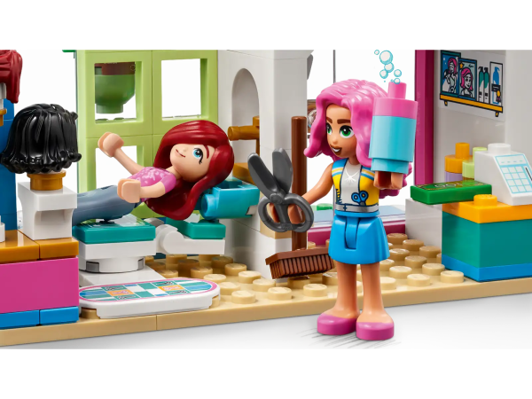Kids aged 6 and up will love exploring the LEGO® Friends Hair Salon (41743) with Paisley and Olly. This set tells the story of shy Paisley, who is worried about getting her hair cut because she doesn’t know what style will suit her. But her kind friend Olly is here to reassure her. Kids can act out the adventure as the friends head to Nadia’s hair salon to create Paisley’s new look. There’s lots to discover, with washing and styling areas inside the salon and a gumball machine, scooter parking area and a bench outside. When Paisley is ready, kids can swap the hairpiece and facial expression to reveal her new style. Boost the fun Kids can enjoy an easy and intuitive building adventure with the LEGO Builder app. Here they can zoom in and rotate models in 3D, save sets and track their progress. Welcome to the next generation of Heartlake City Kids can make friends, discover exciting locations and act out real-life adventures in the LEGO Friends universe. Hair salon building set for kids aged 6+ – Introduce kids who love creative play to the world of building and role play with this fun LEGO® Friends Hair Salon set (41743) 3 mini-dolls – The set comes with LEGO® Friends characters Paisley, Olly and Nadia, the hair salon building with its detailed interior and exterior, plus Olly’s scooter and a park bench Hair salon extras – The set includes accessories such as plants, hair products, money, a gumball machine, sign, heat lamp and a sweeping brush Change Paisley’s look – Kids can swap Paisley’s hair and facial expression to show the different looks from before and after her trip to the hair salon A gift for kids – This LEGO® Friends toy set makes a fun birthday, holiday or any-other-day gift for kids aged 6 and up who would love to build and play with a Hair Salon Measurements – Hair Salon measures over 5.5 in. (14 cm) high, 9.5 in. (25 cm) wide and 3.5 in. (9 cm) deep A fun way to build – Discover intuitive buildinginstructions in the LEGO® Builder app, where kids can zoom in and rotate models in 3D, track progress and save sets as they develop new skills A new generation of Heartlake City – In January 2023, the LEGO® Friends universe expanded to introduce new characters and new locations to inspire more role-play adventures A quality product – All LEGO® components meet strict industry standards to ensure they are consistent, compatible and easy to build with: it’s been that way since 1958 Safetyfirst – LEGO® Friends bricks and pieces are dropped, heated, crushed, twisted and analyzed to make sure they meet stringent global safety standards