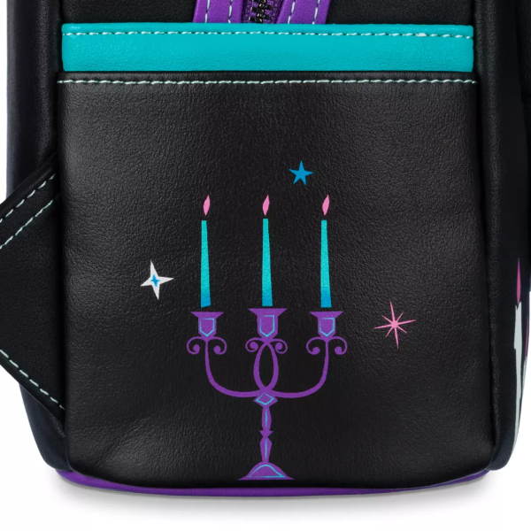 Even without the psychic abilities of Madame Leota, it's possible to see that there's a frightfully fashionable backpack in your future. One of the notorious inhabitants of The Haunted Mansion attraction, Leota's face is framed within her crystal ball on the front of this simulated leather mini backpack by Loungefly that features glow-in-the-dark elements. Magic in the details Created especially for Walt Disney World Resort and Disneyland Resort Simulated leather mini backpack Round exterior front zip pocket features Madame Leota with 3D crystal ball stand detailing Screen art ''Madame Leota - Knower and seer of all'' with The Haunted Mansion logo on back Screen art candles, ribbons and musical instruments on front Screen art candelabra on left side Screen art cat on right side Ribbon, candles and face glow in the dark Double zipper main compartment Loungefly logo metal pulls Blacktone hardware Side slip pockets Fabric lining with allover print of characters and objects from The Haunted Mansion Disney Parks x Loungefly logo label plate Inspired by The Haunted Mansion attraction Part of Disney's Haunted Mansion Trend Collection The bare necessities 60% polyurethane / 40% PVC 10 1/2'' H x 8 3/4'' W x 4 3/4'' D Imported