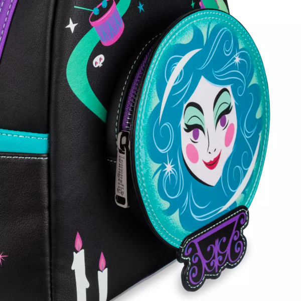 Even without the psychic abilities of Madame Leota, it's possible to see that there's a frightfully fashionable backpack in your future. One of the notorious inhabitants of The Haunted Mansion attraction, Leota's face is framed within her crystal ball on the front of this simulated leather mini backpack by Loungefly that features glow-in-the-dark elements. Magic in the details Created especially for Walt Disney World Resort and Disneyland Resort Simulated leather mini backpack Round exterior front zip pocket features Madame Leota with 3D crystal ball stand detailing Screen art ''Madame Leota - Knower and seer of all'' with The Haunted Mansion logo on back Screen art candles, ribbons and musical instruments on front Screen art candelabra on left side Screen art cat on right side Ribbon, candles and face glow in the dark Double zipper main compartment Loungefly logo metal pulls Blacktone hardware Side slip pockets Fabric lining with allover print of characters and objects from The Haunted Mansion Disney Parks x Loungefly logo label plate Inspired by The Haunted Mansion attraction Part of Disney's Haunted Mansion Trend Collection The bare necessities 60% polyurethane / 40% PVC 10 1/2'' H x 8 3/4'' W x 4 3/4'' D Imported