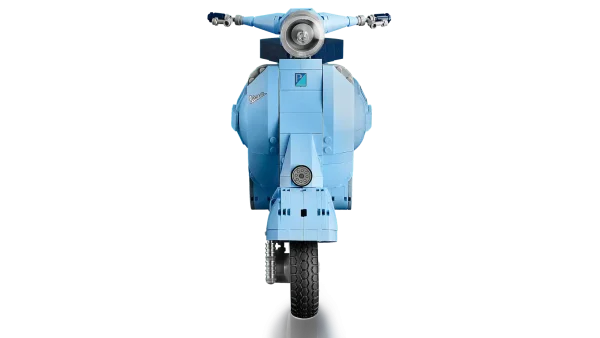 Dive into a mindful building project packed with style with this LEGO® Vespa 125 model kit for adults. Inspired by the classic 1960s Vespa Piaggio, it comes in pastel blue – a very rare LEGO color that’s sure to appeal to building fans. To celebrate Vespa’s 75th anniversary, the LEGO designers have worked closely with the lifestyle brand to recreate this stunning model in an immersive build, especially for adults. Beautiful details. Authentic features Like the original, this buildable model Vespa features a front wheel mounted on one side, 2 seats, a removable engine cover with a brick-built engine beneath, a functioning kickstand, plus working steering. Finishing touches include the Vespa logo, a classic 1960s Italian license plate, a spare wheel, a helmet, plus an accessories basket including a flower bouquet on the back. Welcome to your zone Build creativity. Build concentration. Build your dream vehicle collection with exclusive, authentic model vehicles, made specifically for adults. Assemble your own LEGO® Vespa 125 – Build a detailed displayable model of an Italian icon with this building set (10298) for adults Inspired by the original – This brick-built Vespa features a front wheel mounted on one side, 2 seats, a removable engine cover with a brick-built engine underneath, and working steering Extra details – Finishing touches include the Vespa logo, a classic 1960s Italian license plate, a spare wheel, helmet and an accessories basket with flower bouquet Designed for Vespa fans – To celebrate Vespa’s 75th anniversary, the LEGO® designers have worked with the lifestyle brand to create a model to appeal to lovers of Italian culture A rare color – Presented in pastel blue, one of the Vespa’s original production colors and an extremely rare LEGO® color designed to appeal to LEGO fans Celebrate La Dolce Vita – With its functioning kickstand, this model can be placed on display in the home or office to create your own tribute to Vespa Dimensions – This collectible display model measures over over 8.5 in. (22 cm) high, 13.5 in. (35 cm) long and 4.5 in. (12 cm) wide A project for adults – This LEGO® set is part of a range of building sets designed for adult building fans and makes a gift idea for Vespa fans Quality materials – LEGO® building bricks are manufactured from high-quality materials. They’re consistent, compatible and connect and pull apart easily every time: it’s been that way since 1958 Safety ensured – With LEGO® pieces, safety and quality come first. That’s why they’re rigorously tested so you can be sure that this Vespa model kit is robust