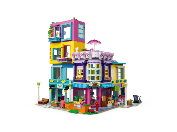 LEGO® Friends fans aged 8+ will love hanging out in the heart of the community with the LEGO® Friends Main Street Building (41704) set. It comprises 3 buildings that join to form a neighborhood block with apartments. There’s a hairdresser, an international food market and a book café. As each element is modular, creative kids will love configuring the buildings however they choose! It comes with 12 figures so imaginative role-play possibilities are endless. Playset with presence – Measuring over 9 in. (24 cm) high, 15 in. (39 cm) wide and 6 in. (16 cm) deep, this extensive set is a display piece with real presence This set is packed with creative accessories to spark imaginative storytelling LEGO® Friends gifts satisfy rigorous global safety standards