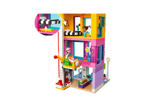 LEGO® Friends fans aged 8+ will love hanging out in the heart of the community with the LEGO® Friends Main Street Building (41704) set. It comprises 3 buildings that join to form a neighborhood block with apartments. There’s a hairdresser, an international food market and a book café. As each element is modular, creative kids will love configuring the buildings however they choose! It comes with 12 figures so imaginative role-play possibilities are endless. Playset with presence – Measuring over 9 in. (24 cm) high, 15 in. (39 cm) wide and 6 in. (16 cm) deep, this extensive set is a display piece with real presence This set is packed with creative accessories to spark imaginative storytelling LEGO® Friends gifts satisfy rigorous global safety standards