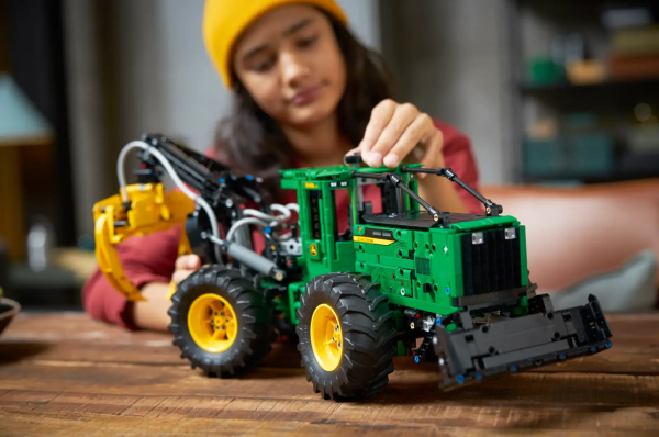 Give John Deere fans an experience to remember as they recreate all the details of one of the iconic manufacturer’s biggest machines. Kids aged 11+ with a passion for engineering and agriculture will love exploring all the features packed into this LEGO® Technic™ John Deere 948L-II Skidder building kit. Authentic functions include steering, 4-wheel drive and a working engine. There’s also a range of pneumatic functions – just like on the real skidder – that operate the claw with its 3 different actions, the blade and the rotating seat. Begin a building adventure Kids can enjoy an easy and intuitive building experience with the LEGO Builder app. Here they can zoom in and rotate models in 3D, save sets and track their progress. Explore the world of engineering LEGO Technic buildable toys feature realistic movement and mechanisms that introduce LEGO builders to the universe of engineering in an approachable and realistic way. A build for John Deere fans – Kids aged 11+ can build and explore a replica version of the manufacturer’s mighty machine with this LEGO® Technic™ John Deere 948L-II Skidder (42157) model toy set Pneumatic functions – Kids can explore what this machine can do using the pneumatic features to operate the claw which has 3 different actions. A rotating seat adds extra realism Mechanical functions – This build comes with features inspired by the real John Deere 948L-II Skidder, including steering, 4-wheel drive and a moving engine A building kit gift for kids aged 11+ – This LEGO® Technic™ John Deere 948L-II Skidder buildable toy model makes a gift idea for kids who love logging toys and mighty machines Measurements – This LEGO® Technic™ building set measures over 8 in. (21 cm) high, 21 in. (53 cm) long and 7.5 in. (19 cm) wide A helping hand – Discover intuitive instructions in the LEGO® Builder app, where builders can zoom in and rotate models in 3D, track their progress and save sets as they develop new skills An introduction to engineering – LEGO® Technic™ buildable model sets feature realistic movement and mechanisms that introduce young LEGO builders to the universe of engineering High quality – LEGO® Technic™ components meet rigorous industry standards to ensure they are consistent, compatible and connect reliably every time Safety first – LEGO® Technic™ components are dropped, heated, crushed, twisted and analyzed to make sure they meet strict global safety standards