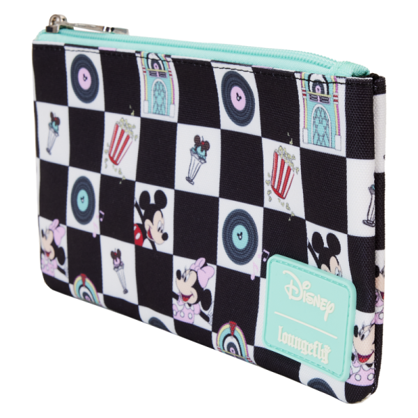 Select a song from the jukebox and prepare to dance! Our Loungefly Disney Mickey Mouse and Minnie Mouse Date Night Diner All-Over-Print Nylon Wristlet is ready for fun. This accessory features an all-over black-and-white checkered pattern, reminiscent of a dance floor in a 1950s diner. Inside the white checker boxes, you’ll find printed images of records, jukeboxes, Disney’s Mickey Mouse and Minnie Mouse, popcorn, and ice cream sundaes. Accents of teal add a retro pop of color. When you open the wallet, there are approximately four slots for holding cards and securing valuables. Bring your plus one, and this wallet, to kick up your heels in style. The Loungefly Disney Mickey Mouse and Minnie Mouse Date Night Diner All-Over-Print Nylon Wristlet is made of nylon. Wallet zips closed with silver-colored metal hardware. Additional features include printed details. Take note of the inside lining with the Loungefly logo. This wallet is an officially licensed Disney product. Wallet dimensions: 7”W x 4.5”H More Details