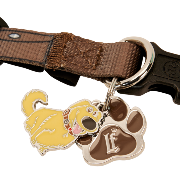 Teach your dog a new trick with the Loungefly Disney-Pixar Up 15th Anniversary Dug Collar! Inspired by the collar that allows Dug to communicate with humans, this accessory shows buttons, dials, and speakers along its printed nylon strap. The signature Loungefly plaque accompanies a crown on the collar’s buckle, and enamel charms shaped like a pawprint and Dug appear on the leash hook. Whether you’re roaming the neighborhood or touring Paradise Falls, this accessory adds stylish flair to your pet’s next big adventure. The Loungefly Disney-Pixar Up 15th Anniversary Dug Collar is made with durable nylon material and features printed details. Collar adjusts for safety/fit and includes shiny silver hardware. This collar is an officially licensed Disney-Pixar product. Collar dimensions: (Small) 0.5”W, Neck: 9”-13”; (Medium) 0.75”W, Neck: 13”-20”; (Large) 1”W, Neck: 18”-29”