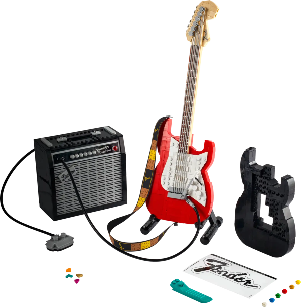 Create your own brick-built 1970s Fender® Stratocaster™ guitar and 65 Princeton® Reverb amplifier with this LEGO® Ideas set (21329). Recall the legendary musicians who have played a Stratocaster® as you recreate its iconic curves and add authentic details such as the posable whammy bar, pickup switch and tuning pegs. The buildable amp has removable panels for easy viewing of the motherboard, reverb tank, speaker and other interior details, plus rubber cables to connect it to the guitar and footswitch. Striking centerpiece This set includes bricks to build the guitar in either red or black, guitar picks in 4 colors and an elegant, foldable stand for the guitar model to complete a delightful display piece. There is also a sticker with the Fender logo made from LEGO bricks for you to attach to your real guitar or amp. Cool collectible This building kit is part of a collection of LEGO sets for adults. It’s a top gift idea for guitar players, Fender fans, music lovers and keen LEGO builders. Recreate a legendary guitar with this wonderfully detailed LEGO® Ideas build-and-display model (21329) of a 1970s Fender® Stratocaster® guitar and a buildable Fender 65 Princeton® Reverb amplifier. The guitar features a posable whammy bar, pickup switch and tuning pegs, six strings, Fender® logo stickers, and a textile strap. The bricks included let you build the guitar in red or black. The amplifier has removable panels for easy viewing of the motherboard, reverb tank, speaker and other interior details, logo stickers, plus connecting rubber cables for the guitar and footswitch. Includes a foldable display stand for the guitar, model-scale guitar picks in 4 colors, plus a sticker of the Fender® logo built from LEGO® bricks to put on your real guitar, amp or wherever you want. Guitar measures over 14 in. (36 cm) long, 4 in. (11 cm) wide and 1 in. (3 cm) deep. This LEGO® display model makes a cool gift for guitar players, music lovers and Fender® Stratocaster® guitar fans. Fun to build solo or with friends and family to share your love of this iconic guitar, music and/or building with LEGO® bricks. This 1,079-piece set comes with a booklet about the history of the Fender® Stratocaster® guitar, the set’s fan designer and LEGO® designers, plus step-by-step instructions for a joyful build. This cool building set was entered in the LEGO® Ideas ‘Music to our Ears’ contest by a fan designer and chosen from the top 9 entries to become the next LEGO Ideas set by the LEGO Ideas review board. LEGO® components meet stringent industry standards to ensure simple, secure connections and robust builds. It’s been that way since 1958. LEGO® building bricks and pieces are tested in almost every way imaginable to ensure that every LEGO set satisfies rigorous global safety standards.