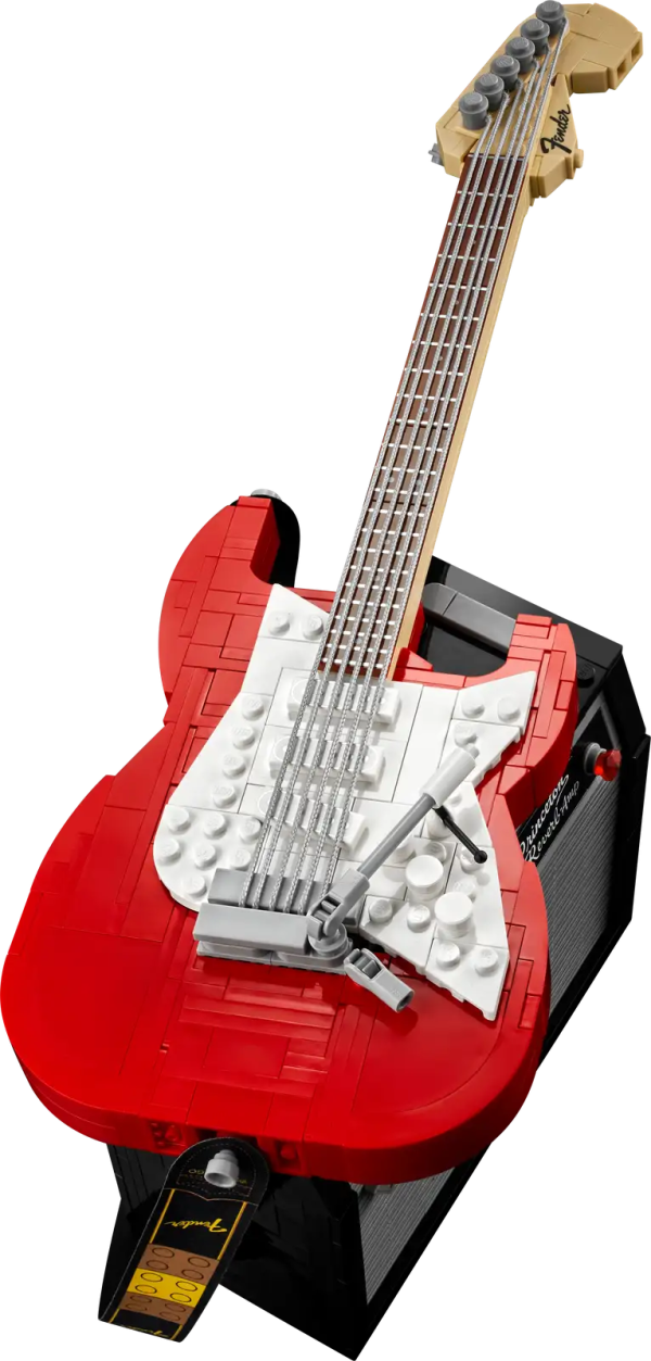 Create your own brick-built 1970s Fender® Stratocaster™ guitar and 65 Princeton® Reverb amplifier with this LEGO® Ideas set (21329). Recall the legendary musicians who have played a Stratocaster® as you recreate its iconic curves and add authentic details such as the posable whammy bar, pickup switch and tuning pegs. The buildable amp has removable panels for easy viewing of the motherboard, reverb tank, speaker and other interior details, plus rubber cables to connect it to the guitar and footswitch. Striking centerpiece This set includes bricks to build the guitar in either red or black, guitar picks in 4 colors and an elegant, foldable stand for the guitar model to complete a delightful display piece. There is also a sticker with the Fender logo made from LEGO bricks for you to attach to your real guitar or amp. Cool collectible This building kit is part of a collection of LEGO sets for adults. It’s a top gift idea for guitar players, Fender fans, music lovers and keen LEGO builders. Recreate a legendary guitar with this wonderfully detailed LEGO® Ideas build-and-display model (21329) of a 1970s Fender® Stratocaster® guitar and a buildable Fender 65 Princeton® Reverb amplifier. The guitar features a posable whammy bar, pickup switch and tuning pegs, six strings, Fender® logo stickers, and a textile strap. The bricks included let you build the guitar in red or black. The amplifier has removable panels for easy viewing of the motherboard, reverb tank, speaker and other interior details, logo stickers, plus connecting rubber cables for the guitar and footswitch. Includes a foldable display stand for the guitar, model-scale guitar picks in 4 colors, plus a sticker of the Fender® logo built from LEGO® bricks to put on your real guitar, amp or wherever you want. Guitar measures over 14 in. (36 cm) long, 4 in. (11 cm) wide and 1 in. (3 cm) deep. This LEGO® display model makes a cool gift for guitar players, music lovers and Fender® Stratocaster® guitar fans. Fun to build solo or with friends and family to share your love of this iconic guitar, music and/or building with LEGO® bricks. This 1,079-piece set comes with a booklet about the history of the Fender® Stratocaster® guitar, the set’s fan designer and LEGO® designers, plus step-by-step instructions for a joyful build. This cool building set was entered in the LEGO® Ideas ‘Music to our Ears’ contest by a fan designer and chosen from the top 9 entries to become the next LEGO Ideas set by the LEGO Ideas review board. LEGO® components meet stringent industry standards to ensure simple, secure connections and robust builds. It’s been that way since 1958. LEGO® building bricks and pieces are tested in almost every way imaginable to ensure that every LEGO set satisfies rigorous global safety standards.