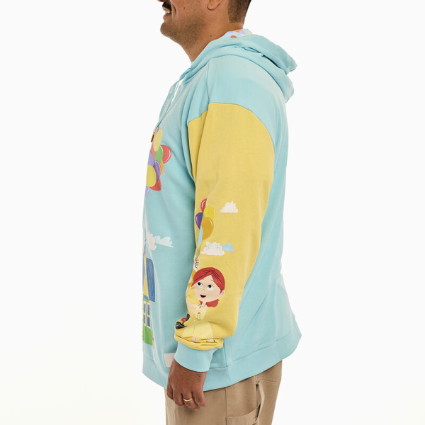 Up, up, and away! Let your adventures take flight with the Loungefly Disney-Pixar Up 15th Anniversary Unisex Hoodie. On the front, Carl and Ellie’s house floats through the sky with the help of colorful balloons. Pockets appear on each side of the sweatshirt, giving you space to store your belongings. On one sleeve, a young Carl and Ellie drift on a bouquet of balloons. On the other, Carl stands with Russel and Dug. Extra-large drawcords cinch together the hood, which features an all-over printed lining of clouds and balloons. This comfortable hoodie makes a heartwarming addition to any outfit and will keep you looking stylish on all your travels. The Loungefly Disney-Pixar Up 15th Anniversary Unisex Hoodie is made of French Terry cotton (60% cotton, 40% polyester). Extra-large lanyard-style drawcords add versatility in wear and fit and are perfect for displaying your favorite pins. Cuffs and waistband are 95% cotton and 5% spandex. This hoodie is an officially licensed Disney-Pixar product. Comes in unisex sizes S through 3X.