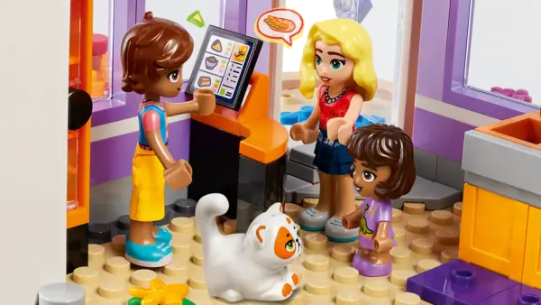 Little chefs aged 8+ can dream up delicious adventures at the LEGO® Friends Heartlake City Community Kitchen (41747). This building toy for kids shows the relationship between Leo, his sister Alba and their grandmother, who runs the kitchen. Leo loves to learn new cooking techniques and the set comes with lots of ingredients and accessories so kids can explore new things too. There’s a pantry, toy refrigerator, sink and a kitchen range with pans and a tortilla press. Outside, there’s seating and a roof terrace. This set combines with the LEGO Friends Heartlake City Community Center 41748 (sold separately) for even more community-based fun. Boost the fun Kids can enjoy an easy and intuitive building adventure with the LEGO Builder app. Here they can zoom in and rotate models in 3D, save sets and track their progress. Welcome to the next generation of Heartlake City Kids can make friends, discover exciting locations and act out real-life adventures in the LEGO Friends universe. Cooking play for kids aged 8+ – Kids who love getting creative in the kitchen can have fun building and playing with the LEGO® Friends Heartlake City Community Kitchen toy (41747) 5 characters and accessories – The set comes with LEGO® Friends characters Leo, Alba, Abuelita, Churro the cat and a customer called Matilde, plus lots of accessories for role play Toy kitchen accessories – Inspire imaginative play with accessories that include a variety of ingredients, a pantry, refrigerator and a sink. There’s also a kitchen range, utensils and outdoor seating Build the fun – This set can be added to the LEGO® Friends Heartlake City Community Center 41748 (sold separately) to create endless play opportunities inspired by community friendships A gift for kids – This building toy for kids makes an imaginative birthday, holiday, or anytime gift for kids who love cooking and kitchen role play Measurements – The community kitchen measures over 8 in. (22 cm) high, 8 in. (22 cm)wide and 6 in. (17 cm) deep A helping hand – Discover intuitive instructions in the LEGO® Builder app, where builders can zoom in and rotate models in 3D, track their progress and save sets as they develop new skills A new generation of Heartlake City – In January 2023, the LEGO® Friends universe expanded to introduce new characters and new locations to inspire more role-play adventures A quality product – All LEGO® components meet strict industry standards to ensure they are consistent, compatible and easy to build with: it’s been that way since 1958 Safety first – LEGO® Friends bricks and pieces are dropped, heated, crushed, twisted and analyzed to make sure they meet stringent global safety standards