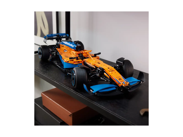 Remove all distractions. Channel your competitor's focus. It’s time to build a highly detailed LEGO® Technic™ McLaren Formula 1™ Race Car 42141 model. When you cross the finish line, you’ll feel immense pride – with an impressive display model to celebrate your dedication. A close collaboration between the LEGO Group and McLaren Racing For 2022, the LEGO Technic designers have worked closely with the designers at McLaren Racing. Both sets of experts developed their model at the same time, making this a very special collaboration. Just like the real car, this LEGO Technic version features a V6 cylinder engine with moving pistons, steering, suspension and differential. Drive your passion Racing drivers call it the zone. A state of heightened concentration required for you to perform at your very best. Now it’s time for you to get in the zone as you channel that same focus to recreate your favorite vehicles with LEGO Technic sets, designed for adults and fans of collectible cars. A build for Formula 1™ fans – Construct a detailed model replica of McLaren’s 2022 F1 car with this LEGO® Technic™ McLaren Formula 1 Race Car (42141) building set for adults A close collaboration – The LEGO® designers worked closely with the team at McLaren Racing, with both sets of experts developing their version of the car at the same time for the 2022 race season Modelled on the real car – Includes features like the V6 cylinder engine with moving pistons, steering, suspension and differential for precision cornering A project for adults – This McLaren F1 replica offers adult LEGO® builders the opportunity to become immersed in their passion, letting them enjoy a mindful build with a display piece to relish Measurements – This LEGO® Technic™ McLaren F1 model measures over 5 in. (13 cm) high, 25.5 in. (65 cm) long and 10.5 in. (27 cm) wide Detailed building instructions – As well as a guide to constructing the model, the coffee-table-style instructions explain the collaboration between McLaren Racing and the LEGO® designers Sponsor stickers – Add the finishing touch to your model by adding sponsor stickers, like those seen on a real F1 race car Welcome to your zone – The LEGO® Technic™ universe offers advanced buildable models for adult LEGO fans looking for a rewarding construction experience with a display piece to enjoy High quality – LEGO® Technic™ components meet rigorous industry standards to ensure they are consistent, compatible and connect reliably every time Safety first – LEGO® Technic™ components are dropped, heated, crushed, twisted and analyzed to make sure they meet strict global safety standards