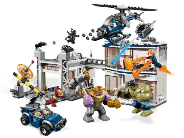 Stage a thrilling 76131 Avengers Compound Battle and defeat Thanos and the Outrider with this LEGO® Marvel Avengers toy building set! The Avengers headquarters features a 2-level office building with a meeting room—including a table with a secret gun compartment, an opening ‘laser-beam' safe, helipad, garage, rooftop spring-loaded shooter and dual stud shooters, plus a rotating, tilting radar. This popular toy construction set also includes a buildable toy helicopter with adjustable, spinning rotors and 6-stud rapid shooter, and an offroader with a rotating turret with dual stud shooter. Play out thrilling scenes from the Marvel Avengers movies with 4 minifigures, an Ant-Man microfigure and posable Hulk and Thanos big figures. This buildable superhero playset includes 4 Marvel Universe minifigures: Iron Man, Captain Marvel, Nebula and a 4-armed Outrider, plus posable Hulk and Thanos big figures and an Ant-Man microfigure. This construction toy features the Avengers compound with a 2-level office building, helipad, garage, plus a helicopter and offroader for creative play. The office building features: 2 Avengers ‘A' logo elements on the exterior wall; rotating, tilting spring-loaded shooter on the rooftop; lower level with an entrance, buildable rotating computer and a ‘laser-beam’ safe; and an upper level with a meeting room, table with secret compartment, rotating door leading to the helipad and accessory elements including 3 chairs, 2 guns, 3 cups and a jug. The compound also features: a helipad with 2 dual stud shooters and bridge to the office building; garage for the offroader with a ramp, opening barrier and a rotating, tilting radar dish; and tool racks with crowbar, wrench, welder and circular saw elements. Helicopter features an opening minifigure cockpit, 2 spinning, tilting rotors and a 6-stud rapid shooter. Offroader features a minifigure cockpit and rotating turret with dual stud shooter and standing room for a minifigure. Weapons include Nebula's sword and Thanos's buildable, double-sided battle axe. Accessory elements include Captain Marvel 10 Power Bursts for imaginative play. The Iron Man minifigure and Thanos and Hulk big figures are all new for March 2019, and the Nebula minifigure and Ant-Man microfigure each feature new-for-March-2019 Avengers team suit decoration. Recreate exciting scenes from the Marvel Avengers movies with this action-packed superhero toy building set for kids. Avengers compound measures over 6” (17cm) high, 11” (29cm) wide and 7” (20cm) deep. Helicopter measures over 3” (9cm) high, 5” (14cm) long and 1” (5cm) wide. Offroader measures over 2” (7cm) high, 4” (11cm) long and 2” (6cm) wide.