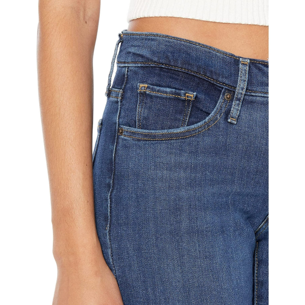 This five-pocket jean features a mid-rise and sleek skinny fit for a leg-lengthening silhouette. The front has a specially designed panel that holds you in for a tummy-slimming effect. Signature arcuate stitch highlights the back pockets. Belt loop waistband with brand patch at the back waist. Zip-fly and button closure.