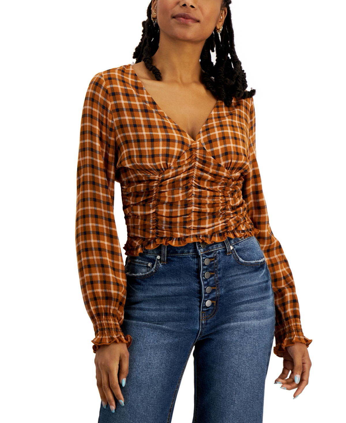 JUNIORS' SMOCKED LONG-SLEEVE TOP IN SUGAR ALMOND PLAID Level up your off-duty looks with this cute smocked top from Crave Fame. It's perfect with your favorite blue jeans and booties. Juniors Juniors' Clothing - Tops