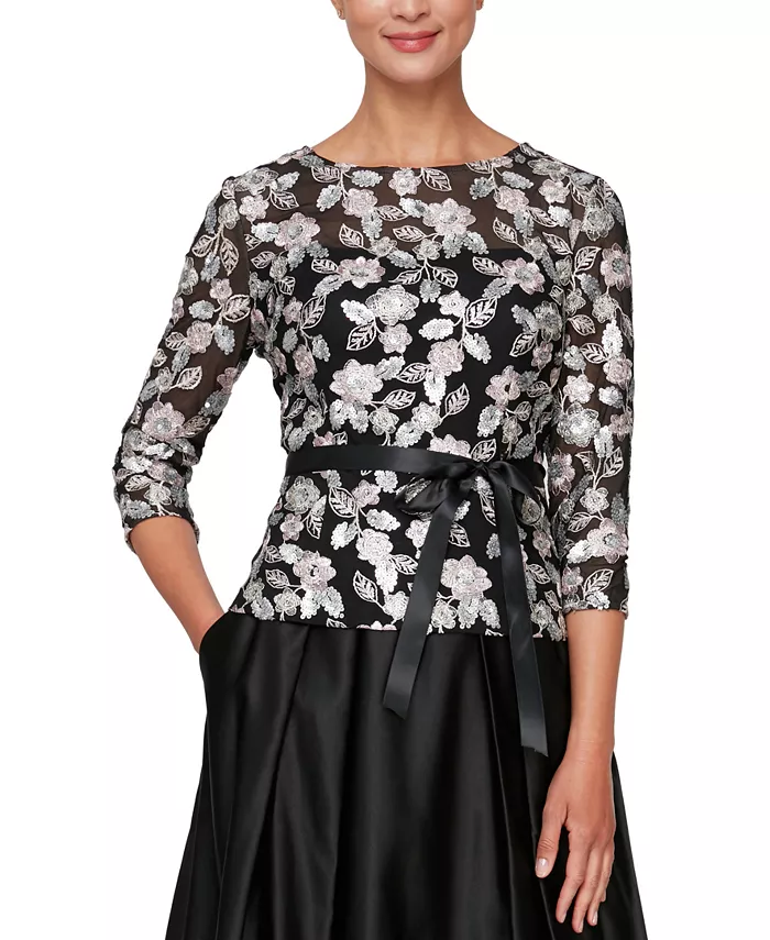 Sequins lend a glamorous finish to this embroidered blouse from Alex Evenings. 3/4-sleeves Scoop neckline Self-tie belt at waist Sequins may shed during wear Imported