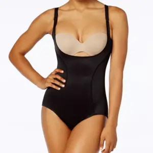 Ideal for body-hugging garments like cocktail dresses and gowns, Maidenform's Ultimate Instant Slimmer Open Bust Body Shaper helps smooth and shape your tummy, waist and back for a smooth, sexy looking appearance. The Wear Your Own Bra feature allows you to wear your favorite bra for any wearing occasion. Style #2656 Helps provide all-over smoothing and control Wear with your own bra to create the shape you desire Imported Row cut hems for ultimate no-show Soft, mesh-covered waistband Helps to smooth and shape tummy, waist and back Provides firm shaping and control Hook-and-eye closure at crotch Adjustable straps (Formerly known as "Flexees by Maidenform")