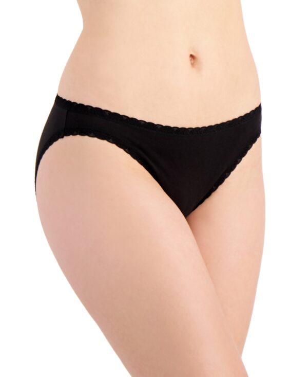 Discover timeless elegance and playful charm with the Jenni Women's Whimsy Dot Bikini in Classic Black. This bikini-style underwear is designed to offer a perfect blend of comfort and sophistication, making it an essential addition to your everyday lingerie collection. Features: Classic Black with Whimsy Dots: The sophisticated black background is adorned with whimsical white dots, adding a touch of playful elegance to your underwear drawer. Bikini Cut: The bikini style offers moderate coverage with a flattering fit that sits comfortably on the hips, making it perfect for everyday wear. Soft Fabric: Crafted from a high-quality, soft fabric blend that feels gentle against the skin, ensuring all-day comfort. Comfort Waistband: The elastic waistband provides a secure fit without digging in, allowing for ease of movement and maximum comfort. Seamless Look: Designed to provide a smooth silhouette under clothing, this bikini eliminates visible panty lines, ensuring a sleek and polished look. Material: Body: 93% Cotton, 7% Spandex Care Instructions: Machine wash cold with similar colors Use only non-chlorine bleach when needed Tumble dry low Do not iron