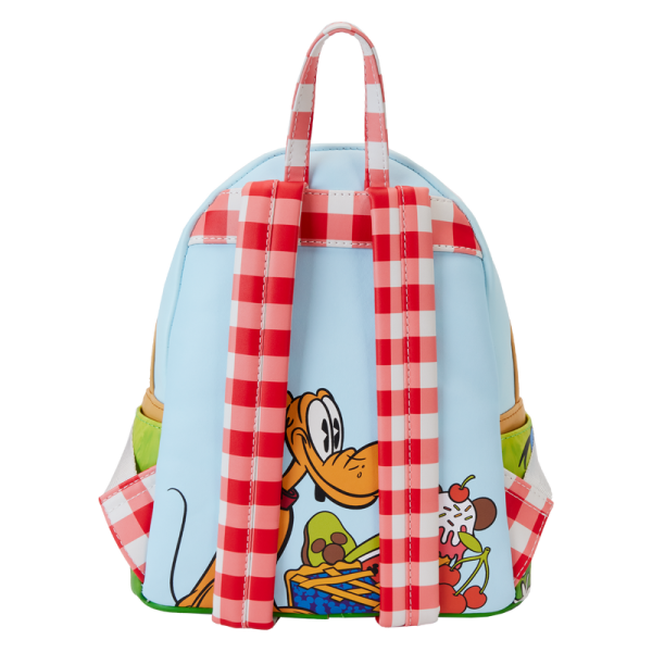 Life’s a picnic when you’re with your pals! Spend a sunny day in the countryside with the Loungefly Mickey and Friends Picnic Mini Backpack. On the front, a woven picnic basket takes shape on the bag’s zipper pocket. Look inside the basket to find a Mickey-shaped pie, which doubles as a strawberry-scented coin bag! Minnie and Mickey appear up above while Donald, Daisy, and Goofy join the fun on the bag’s side pockets. On the back, gingham shoulder straps accompany Pluto as he sizes up a tasty feast. This mini backpack makes a stylish addition to any outing and has plenty of room to pack your picnic essentials. The Loungefly Mickey and Friends Picnic Mini Backpack is made of vegan leather (polyurethane). Bag has adjustable shoulder straps, removeable coin bag (polyurethane), and shiny gold hardware. Additional features include applique, debossed, scented, and printed details. Take note of the coordinating inside lining. This backpack is an officially licensed Disney product. Backpack dimensions: 9”W x 10.5”H x 4.5”D