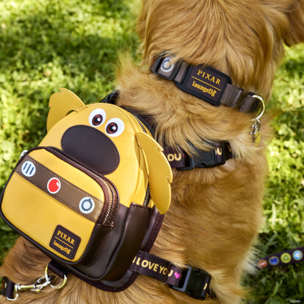 We have just met him, and we love him! Give your best friend a stylish new look with the Loungefly Disney-Pixar Up 15th Anniversary Dug Cosplay Mini Backpack Harness. On the front of the backpack, Dug takes shape with floppy ears and a big round nose. His communication collar appears on the zipper pocket below, where a sturdy ring can attach to a leash. Dug’s signature catchphrase appears on the adjustable harness straps, which connect to a comfortable mesh padding lined with metallic details. With plenty of room for storing essentials, this harness will keep your pet prepared for their next big adventure. The Loungefly Disney-Pixar Up 15th Anniversary Dug Cosplay Mini Backpack is made with durable vegan leather (polyurethane). Harness has adjustable nylon straps and shiny silver hardware. Additional features include applique and debossed details. Take note of the coordinating inside lining. This harness is an officially licensed Disney-Pixar product.