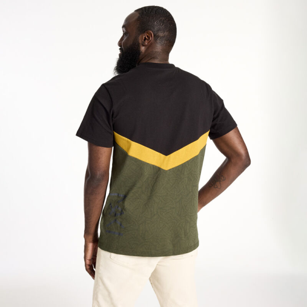 Slip away with a timeless look. The Loungefly COLLECTIV Marvel Loki The ORIGINL Tee offers a simple and versatile way to show off your fandom on any timeline. This classic tee features Loki’s helmet symbol as an embroidered detail, against a dark background. A chevron, in gold, divides color blocks where intricate patterns of Loki’s snake symbol repeat for an extra-subtle expression of your favorite fandom. The Loungefly COLLECTIV Marvel Loki the ORIGINL Tee is super soft and made of 100% cotton jersey. Additional features include seamed color blocking and embroidery. This tee is an officially licensed Marvel product.