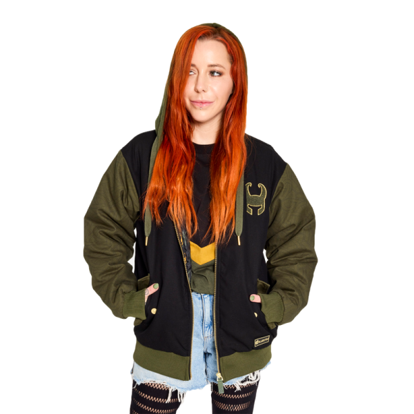 Slip away with a timeless look. The Loungefly COLLECTIV Marvel Loki The WEEKENDR Hooded Jacket offers an elevated way to show off your fandom on any timeline. This heavy-duty jacket features a drawstring hood and elevated gold magnet rivet details of Loki’s helmet symbol on the side pockets. Mixed fabrics, such as a chenille patch of Loki’s symbol in green, against a contrast of darker fabric, will take you from day to night effortlessly. The green color, on the sleeves, creates a background for an elegant pattern of Loki’s snake symbol to take shape. On the back, a matte high-density screen print adds subtle dimension to the “God of Mischief” text. The Loungefly COLLECTIV Marvel Loki The WEEKENDR Hoodie is made of 100% polyester for the canvas outer shell and lining. The jersey-lined hood is 60% cotton and 40% polyester. Additional features include a drawstring hood, gold magnet rivet details, a chenille patch, and printed details. This hoodie is an officially licensed Marvel product. Comes in unisex sizes S through 3X. Sizing is very specific.