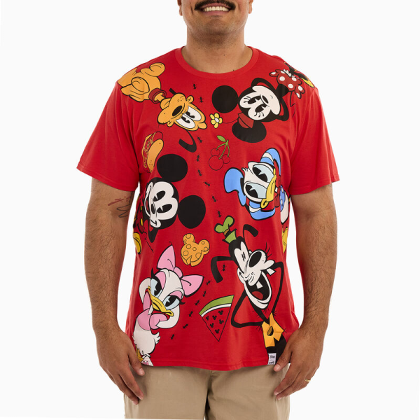 Life’s a picnic when you’re with your pals! Dress your best for a sunny day in the countryside with the Loungefly Mickey and Friends Picnic Unisex Tee. This red tee shirt showcases Mickey, Minnie, Donald, Daisy, Goofy, and Pluto as they lay on a picnic blanket. Look closely and you’ll spot a line of ants marching through a selection of Mickey-inspired snacks! This comfortable tee makes a stylish addition to any outing and is the perfect fit for any Disney-themed wardrobe. The Loungefly Mickey and Friends Picnic Unisex Tee is made of super soft 100% cotton jersey material and features screen-printed details. This tee is an officially licensed Disney product. Comes in unisex sizes S through 3X. Sizing is very specific, so please consult the size chart before purchasing.