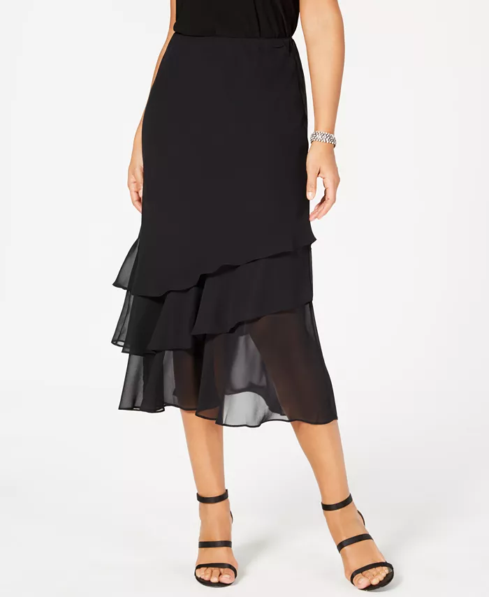 When paired with a sparkly shoe and a shimmery top, the sheer tiers of this Alex Evenings skirt will make you feel like the belle of the ball. Elastic waistband; no closure Made in USA Lined Tiered silhouette