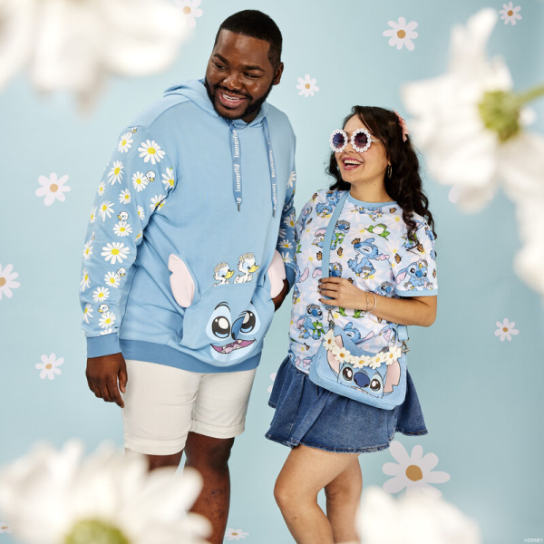 New beginnings are in bloom! Embrace a season of fresh starts with the Loungefly Lilo & Stitch Springtime Stitch Unisex Tee. This comfortable tee shirt features an all-over print of the loveable alien as he makes flower crowns for all his friends. White daisies cover a blue background, where Stitch plays with some frogs and ducklings. Look closely and you may find a butterfly perched on Stitch’s nose! This cute and cozy tee makes an adorable addition to any outfit and will keep you looking stylish on your next outing. The Loungefly Lilo & Stitch Springtime Stitch Unisex Tee is made of super soft 100% cotton jersey material. Please note: Patterns will vary with all-over print styles. Not every piece will look identical nor will every piece be an exact match as to what is pictured online. This tee is an officially licensed Disney product. Comes in unisex sizes S through 3X. Sizing is very specific, so please consult the size chart before purchasing.