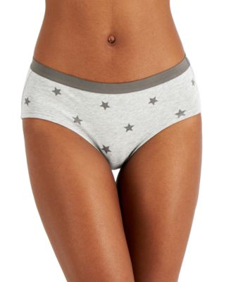 Sure, here is a product description for the Jenni Women's Lightning Hipster Underwear in Grey Stars: Jenni Women's Lightning Hipster Underwear - Grey Stars Elevate your underwear collection with the Jenni Women's Lightning Hipster Underwear in Grey Stars. Combining a trendy design with superior comfort, this hipster underwear is perfect for the modern woman who appreciates both style and functionality. Features: Stylish Design: Featuring a unique lightning bolt and stars pattern on a grey background, this hipster underwear adds a touch of edgy fun to your lingerie collection. Hipster Cut: The hipster style provides moderate coverage with a low-rise fit, ensuring it sits comfortably on the hips without digging in. Comfortable Fabric: Made from a soft, breathable fabric blend that feels gentle against the skin, offering all-day comfort and ease of movement. Secure Fit: Designed to stay in place, this hipster underwear offers a secure fit that won't ride up, making it perfect for everyday wear. Seamless Edges: The seamless edges provide a smooth look under clothing, eliminating visible panty lines for a sleek silhouette. Material: Body: 95% Cotton, 5% Spandex Care Instructions: Machine wash cold with like colors Use only non-chlorine bleach when needed Tumble dry low Do not iron
