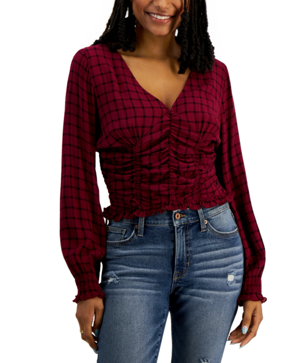 JUNIORS' SMOCKED LONG-SLEEVE TOP IN RICH WINE PLAID Level up your off-duty looks with this cute smocked top from Crave Fame. It's perfect with your favorite blue jeans and booties. Juniors Juniors' Clothing - Tops