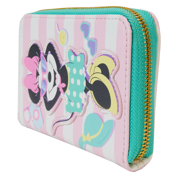 Dreaming of the perfect vacay? Check-in for your next getaway with the Loungefly Minnie Mouse Vacation Style Zip Around Wallet! On the front, Minnie Mouse basks in the sun on a striped beach towel. Look closely and you’ll see her poolside essentials resting beside her! On the back, embroidered tropical plants accompany the striped pattern. Inside, four slots for holding cards accompany a clear window for ID. This wallet adds an air of relaxation to any outing and will keep your belongings safe throughout your stay. The Loungefly Minnie Mouse Vacation Style Zip Around Wallet is made of vegan leather (polyurethane). Wallet zips closed with shiny gold hardware. Additional features include applique, embroidered, and printed details. Take note of the coordinating inside lining and the palm tree-shaped die-cut ID window. This wallet is an officially licensed Disney product. Wallet dimensions: 6”W x 4”H