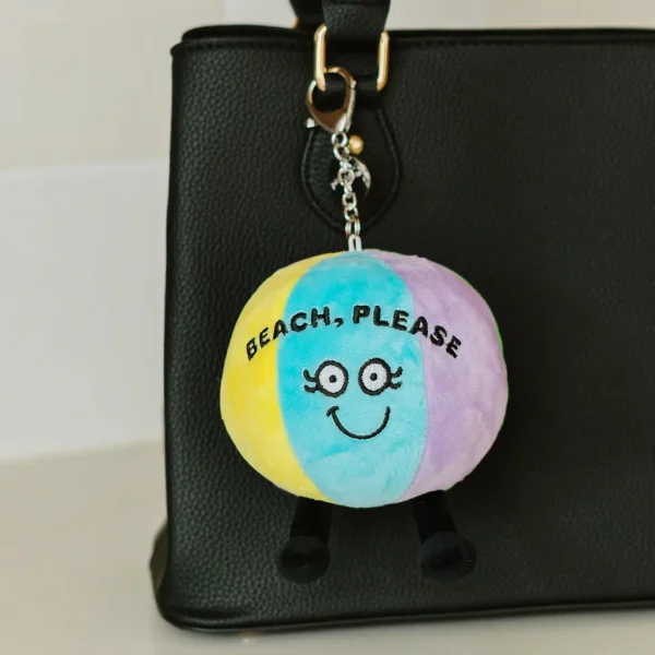 Beach, please! This bag charm is so cute, she’s shore to make a splash! Her flirty eyes, sweet smile, and dangly legs make her impossi-ball to miss. She’s the perfect accent accessory for any purse, bag, or backpack.