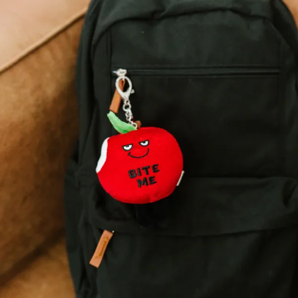 Take a bite out of life with this bag charm. He’s bad to the core and knows how to serve up some sass (just check out that mischievous smile). His cute, dangly legs and leaf accent make him even more ap-peel-ing. He’s the perfect accessory for any purse or backpack.