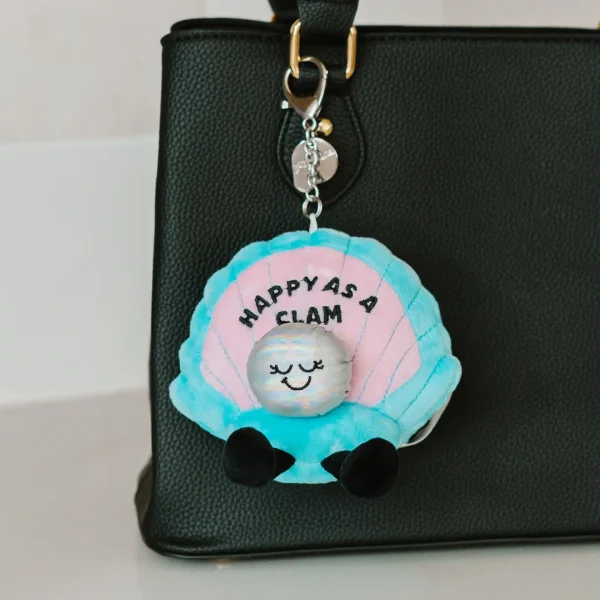 This bite is as happy as a clam! She’s always ready to seas the day! Her pearl accent and sweet smile make her look clamorous. Shell make the perfect accessory to any bag or backpack. Just clip her on, and she’ll remind you to keep clam and carry on.