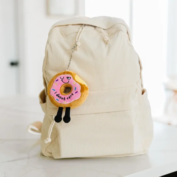 This is one sassy bag charm. We donut need to tell you that he doesn’t care about your opinion a hole lot. However, his sassy wink, colorful sprinkle details, and dangly legs make him a-dough-able. This bite-sized plush would look super cute hanging from any backpack or purse.