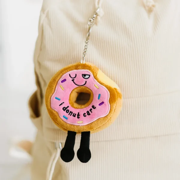 This is one sassy bag charm. We donut need to tell you that he doesn’t care about your opinion a hole lot. However, his sassy wink, colorful sprinkle details, and dangly legs make him a-dough-able. This bite-sized plush would look super cute hanging from any backpack or purse.