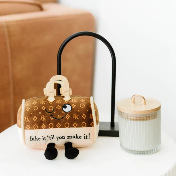 You don’t have it now, but you will one day! This pint-sized charm is here to remind you to never stop purse-uing your dreams. Her sweet wink, tiny handle, and punchy punchline are all the encouragement you need. Pop her onto your backpack or purse for constant inspiration.