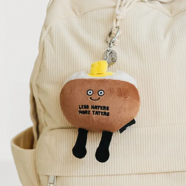 This little bag charm is a spud-tacular cheerleader. His supportive attitude makes him an ap-peel-ing accessory. With this tater, it’s all about the details. This charm’s fluffy tater top, small slab of butter, and tiny chive accents make him the perfect bite. He’d be a fun accessory for any bag or backpack.