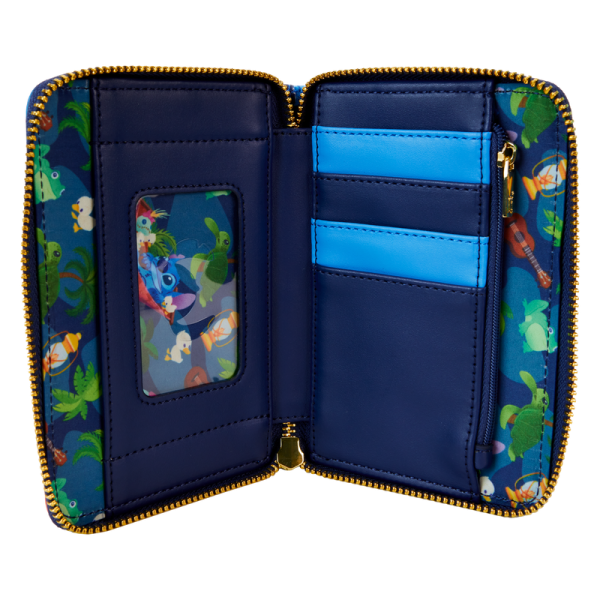 There’s nothing like sharing s’mores under the stars! Camp out on the tropical shores of the great outdoors with the Loungefly Stitch Camping Cuties Zip Around Wallet. On the front, Stitch roasts marshmallows at his campsite. Look closely and you’ll find Scrump, Pudge, and some ducklings join the fun! On the back, a frog sits next to a lantern beneath a starry sky. Open the wallet to reveal four slots for holding cards and a clear slot for ID. This wallet has plenty of room to store your gear and is the perfect accessory for hanging out with friends. The Loungefly Stitch Camping Cuties Zip Around Wallet is made of vegan leather (polyurethane). Wallet zips closed with shiny gold hardware. Additional features include applique, debossed, and printed details. Take note of the coordinating inside lining and Stitch-shaped die-cut ID window. This wallet is an officially licensed Disney product. Wallet dimensions: 6”W x 4”H