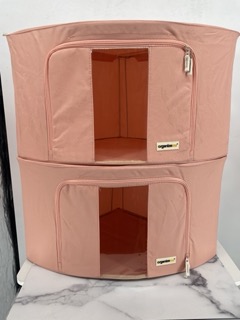 The OrganizeMe Large Corner Soft Bin in Apricot is a stylish and practical storage solution for maximizing space in any room. Designed to fit neatly into corners, this bin offers ample storage for items like clothes, toys, linens, or accessories, helping to keep your space organized and clutter-free. The soft fabric construction makes it lightweight and easy to move, while the warm apricot color adds a modern and inviting touch to your home décor. Ideal for bedrooms, living rooms, or closets, this soft bin provides both functionality and a pop of color, making organizing a breeze.