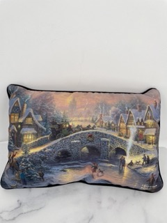 The Thomas Kinkade 18x12" Spirit of Christmas Print Pillow brings the warmth and magic of the holiday season into your home. Featuring a beautiful holiday scene inspired by the iconic artwork of Thomas Kinkade, this decorative pillow showcases a serene, snowy Christmas village illuminated with festive lights. The detailed print captures the essence of Kinkade's signature style, evoking a sense of nostalgia and comfort. The pillow is made with soft, plush materials, offering both comfort and style, making it a perfect addition to your holiday décor. It’s ideal for adding a cozy and festive touch to your living room or bedroom during the holiday season.