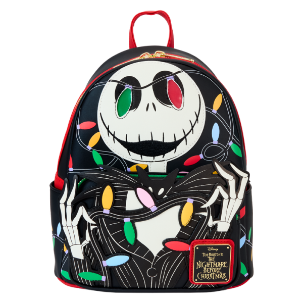 If your eyes light up at the thought of Christmas, this bag’s for you! Jack Skellington embraces the holiday spirit in a tangle of colorful lights. As daylight fades, you’ll see him glow in the dark while two of the lights illuminate with light-up details! This mini backpack makes a festive addition to any outfit and adds a bright spot to any holiday celebration. Features: Vegan leather (polyurethane) Adjustable shoulder straps with printed webbing Front zipper pocket Side drop pockets Shiny gold hardware Applique, embroidered, glow-in-the-dark, LED light, and printed details Coordinating inside lining Dimensions: 9”W x 10.5”H x 4.5”D This backpack is an officially licensed Disney product.