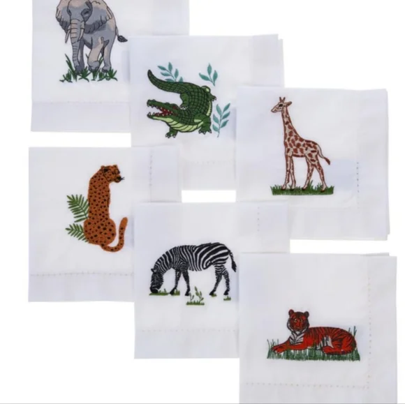 The Patricia Altschul Set of 6 Linen Safari Cocktail Napkins brings a touch of elegance and adventure to your entertaining. Each napkin features a beautifully embroidered safari-themed design, showcasing various wild animals such as lions, elephants, and zebras. Made from high-quality linen, these napkins offer both sophistication and durability, making them perfect for hosting cocktail parties or adding a unique decorative flair to your table setting. The safari theme adds a stylish and whimsical touch, while the linen material ensures a luxurious feel. These napkins are ideal for anyone who appreciates classic style with a playful twist.