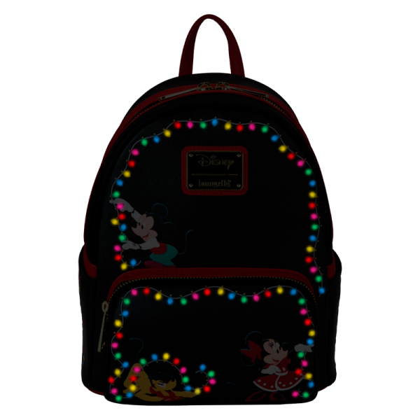 Hip-hip-hooray! Festive lights coming your way! Keep all the holiday lights close wherever you go with our Disney’s Mickey Mouse and Friends light-up mini backpack. An elegant black background makes the festive lights outlining the border on the front pop. Mickey Mouse is at the top, hanging a string of lights, while Disney’s Minnie Mouse and Pluto join in on the pocket below. In the dark, all the lights around the trim on the front light up in different colors! Turn the backpack around, and you’ll find festive prints of lights and Disney’s Chip & Dale, Goofy, Daisy Duck, and Donald Duck. Spread the cheer and warmth of the season in style with this brilliant accessory. Features: Vegan leather (polyurethane) Padded, adjustable shoulder straps Side pockets with artwork Zippered main compartment Zippered front compartment Gold-colored metal hardware Printed, debossed, and light-up details Rechargeable battery Coordinating inside lining Dimensions: 9”W x 10.5”H x 4.5”D This backpack is an officially licensed Disney product.