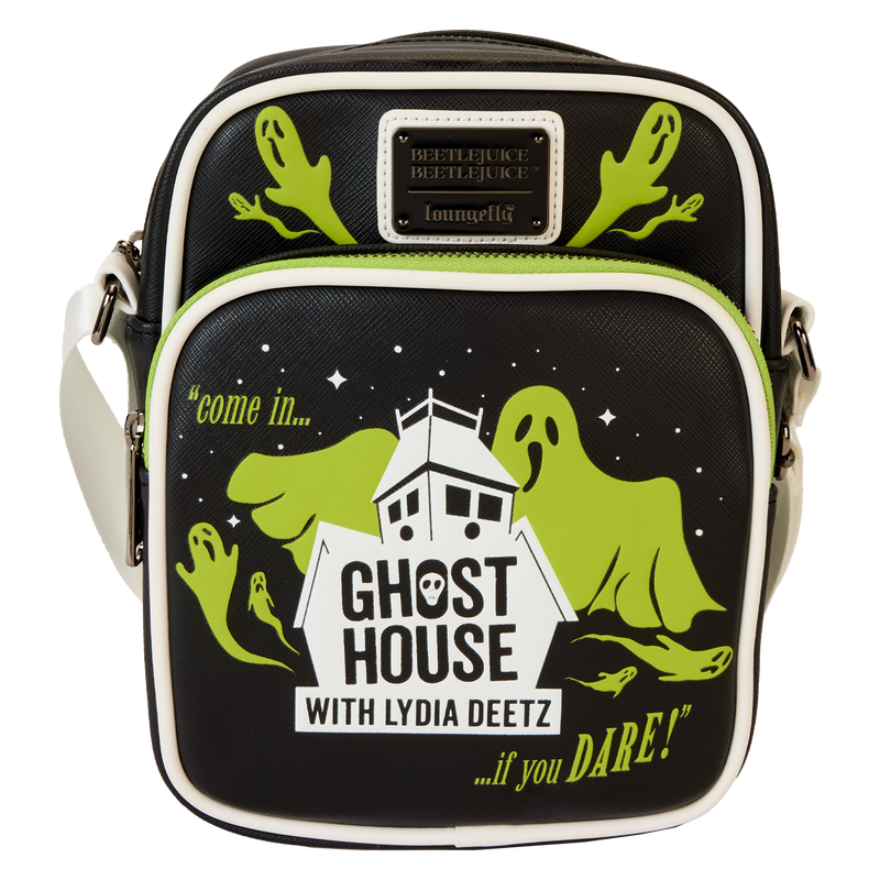 Co-ghost a show in style! Take along our Beetlejuice Beetlejuice crossbody bag featuring Lydia Deetz’s haunting television program. Frightful fun is in the details, which include appliques of eerie-looking ghosts on the front pocket and hovering above. The logo for Lydia’s show, which includes a spooky house and the words “Ghost House with Lydia Deetz,” appear below. Flip the bag around, and more ghosts materialize around the word “Ghostie.” In the dark, all lettering and images glow! Pack your daily essentials and prepare for spine-tingling adventures. Features: Vegan leather (polyurethane) Adjustable strap Zippered main compartment for securing items Zippered front pocket Gunmetal-colored hardware Applique, embossed, glow-in-the-dark, and printed details Coordinating inside lining Dimensions: 6.5”W x 8.5”H x 3”D This bag is an officially licensed Warner Bros. product.