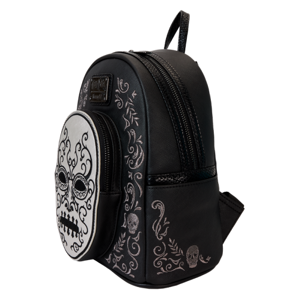 Heading to Malfoy Manor for an important meeting? Do so in style with our Harry Potter™ Death Eater Mini Backpack. This wickedly fashionable accessory features an oval-shaped front pocket with a Death Eater’s face that comes to life in applique, silver metallic vegan leather, and embroidered detail. Elegant flourishes appear on the main part of the backpack, just behind the front pocket, and they continue on the side panels. On one side panel, you will find the image of a serpent, and on the other, a skull. Turn the backpack around, and the incantation for conjuring up the Dark Mark appears: “Morsmordre.” Pack your potions, wand—or daily essentials—and take off on magical adventures in character. Features: Vegan leather (polyurethane) Padded, adjustable shoulder straps with faux snakeskin textured details Side pockets Zippered main compartment for securing items Zippered front compartment for storing smaller items Black metal hardware Applique, metallic vegan leather, embroidered, and printed details Coordinating inside lining Dimensions: 9”W x 10.5”H x 4.5”D This backpack is an officially licensed Warner Bros. product.